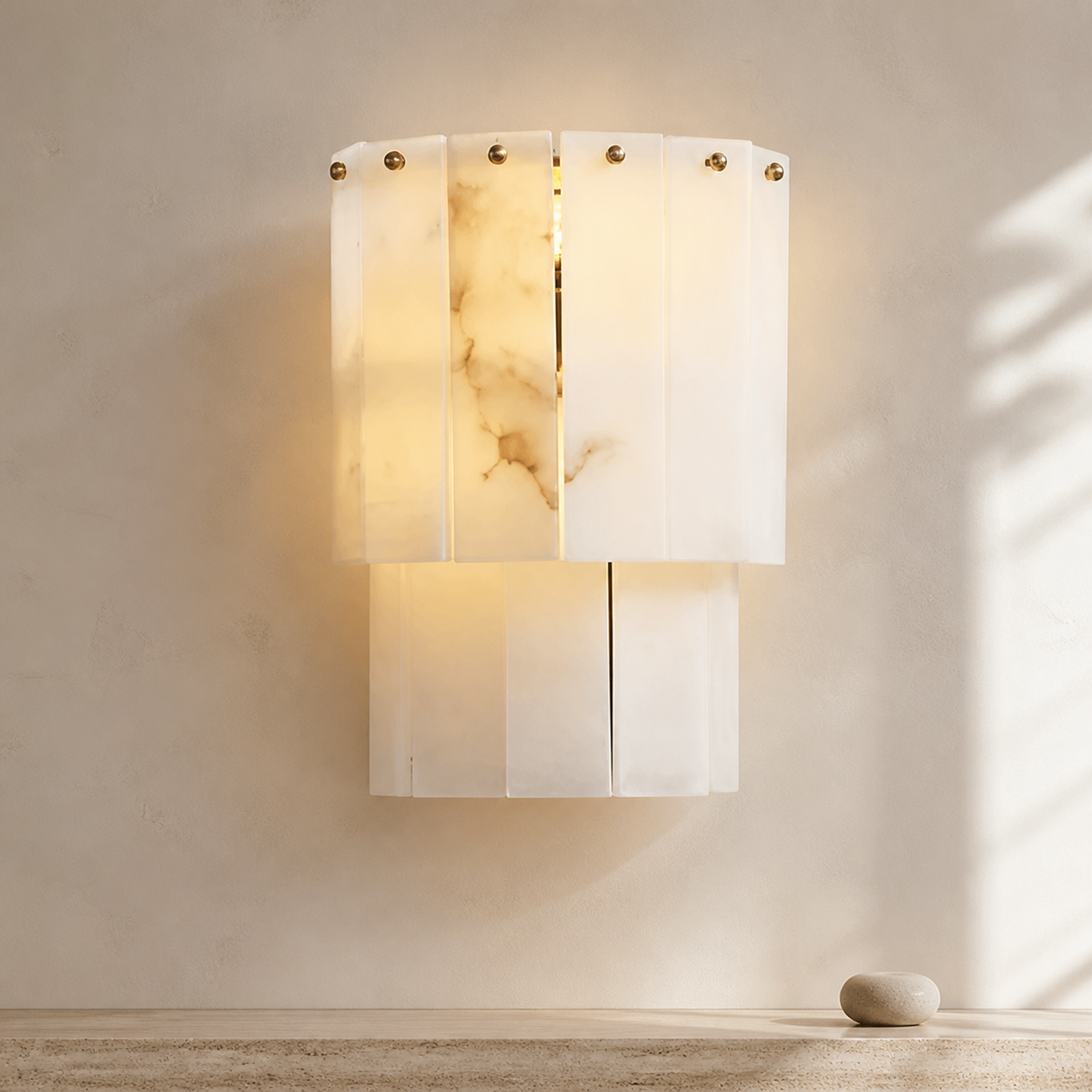 Elegant Layered Alabaster Wall Sconce in a warm neutral Pamlamp interior