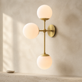 Modere Cirque ModernTriple Sconce in a warm neutral Pamlamp interior