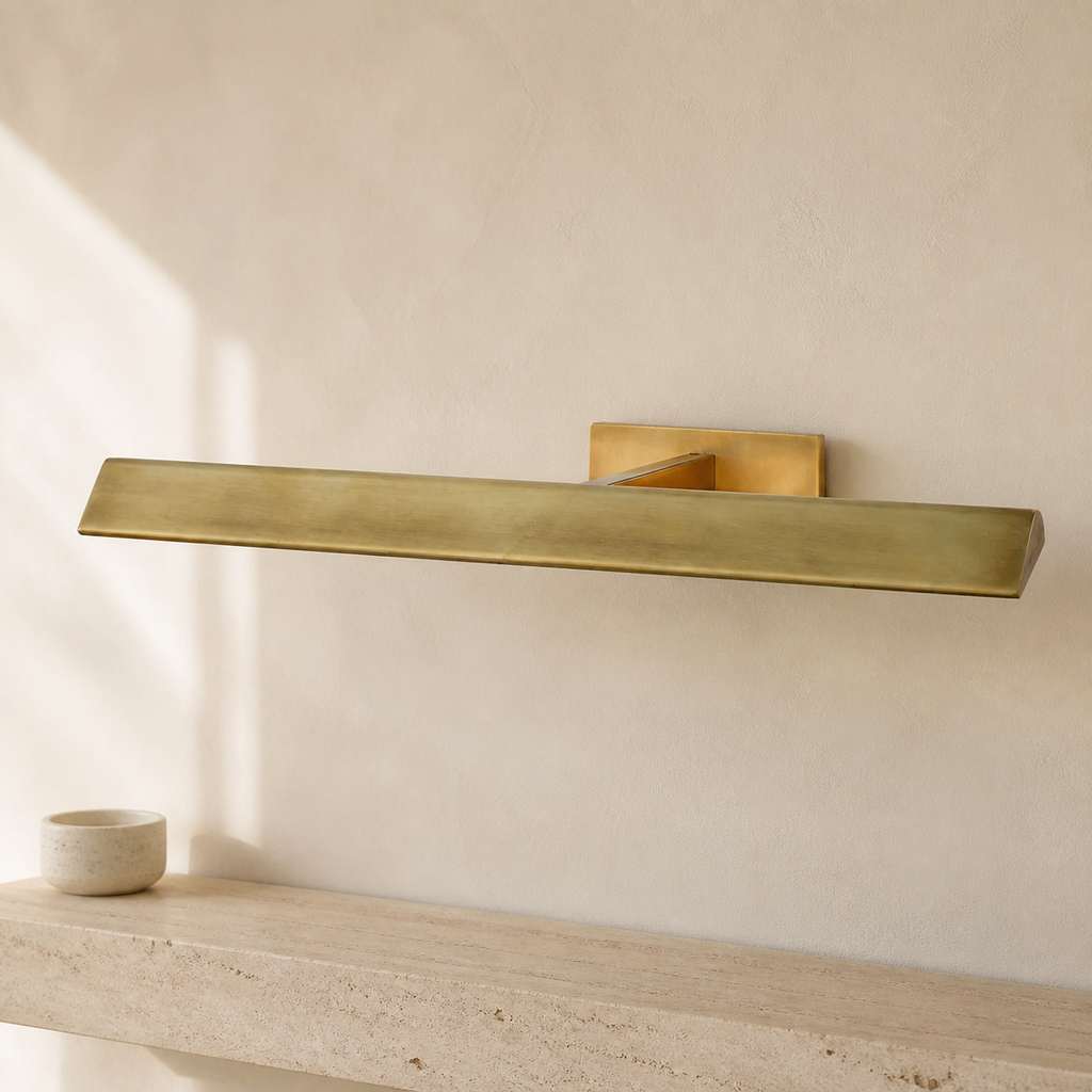 Petrel Modern Brass Picture Light in a warm neutral Pamlamp interior