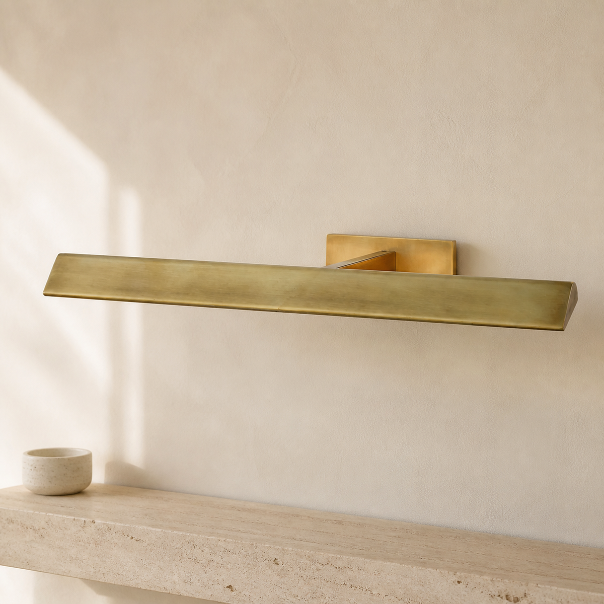 Petrel Modern Brass Picture Light in a warm neutral Pamlamp interior
